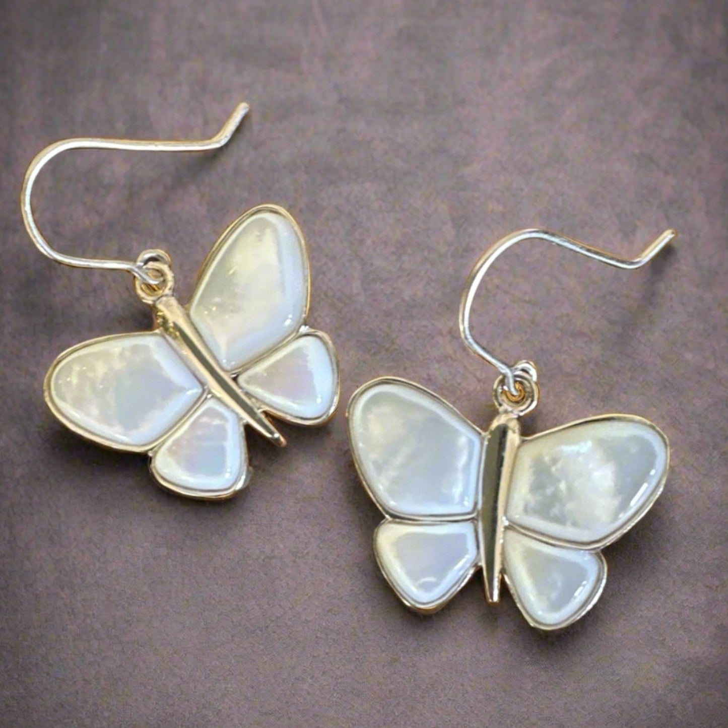 Earrings mother of Pearl .925 sterling silver butterfly dangle earrings.