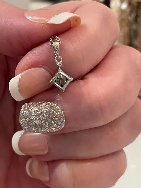 Half of a CT (.50CT) certified Princess Cut Moissanite Blue Diamond Necklace & Pendant. 18" 925 sterling silver.