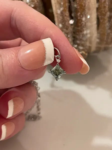Half of a CT (.50CT) certified Princess Cut Moissanite Blue Diamond Necklace & Pendant. 18" 925 sterling silver.